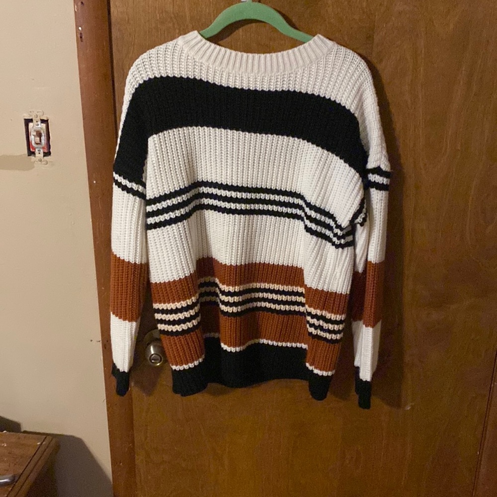 Black whit and brown sweater